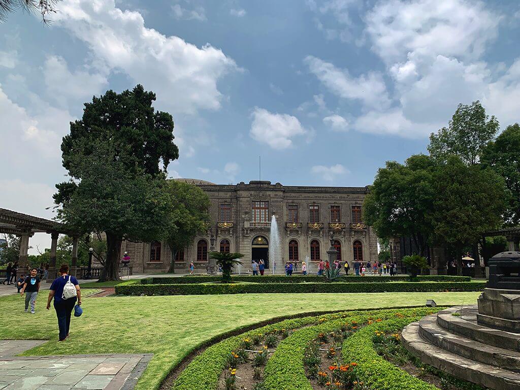 A view of the Castillo de Chapultepec, looking across the lawn and sculpture garden.