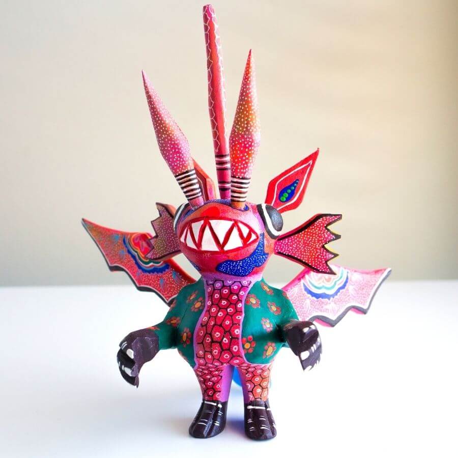 a hand painted dragon-inspired Alebrije, folkloric art