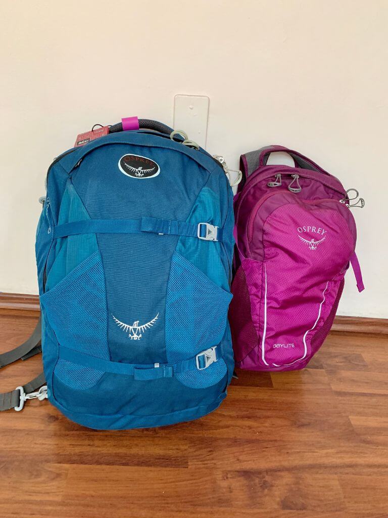 osprey farpoint 40 and osprey daylite packs leaning up against a wall